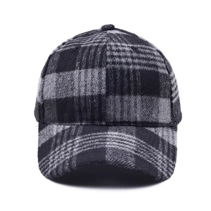 Autumn winter black and grey plaid baseball cap with warm wool-like flannel texture