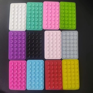 Close-up of rectangle silicone suction pads in 12 colors for phone anti-slip grip
