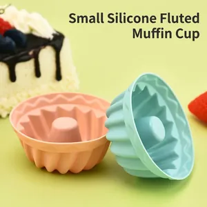 Silicone fluted muffin cups in pink and green for DIY baking and cupcake molding