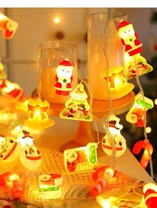 Detail of LED Christmas string lights featuring Santa Claus, snowman and tree shapes