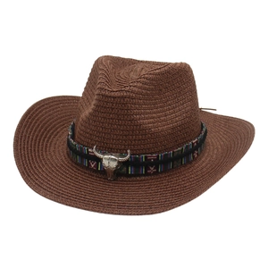 Brown western cowboy straw hat with colorful ethnic band and silver bull head ornament