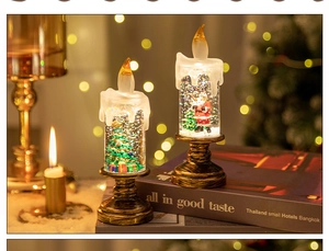 Macro view of vintage Christmas lantern with Santa figurines and swirling glitter