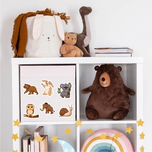 Close-up of cute animal stickers featuring bears and rabbits on a storage box