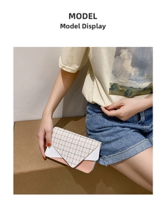 Three-color patchwork crossbody bag with grid pattern and chain strap on model
