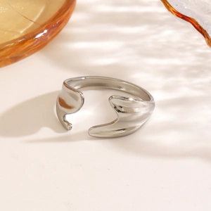 Irregular fishtail open ring in polished silver stainless steel with geometric design