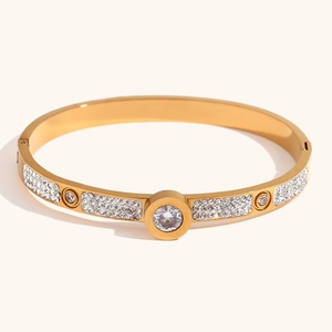 Detail of gold evil eye bracelet with white crystal stones and spring ring clasp