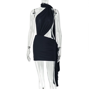 Detail of black halter mini dress with cutout design and ruched asymmetrical hemline