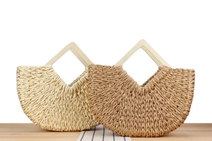 Straw hand-woven beach bags in beige and coffee colors with wooden triangular handles