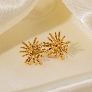 Boucles d'oreilles vintage dorées en forme de soleil avec texture branche sur soie