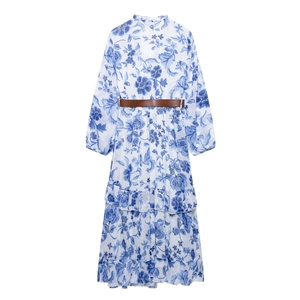 Elegant blue floral long-sleeve maxi dress with V-neck, ruffles, and brown waist belt