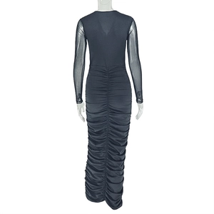 Detail of ruched back design on a long-sleeved black bodycon midi dress with mesh sleeves