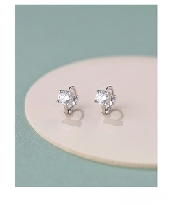 Macro detail of S925 sterling silver hoop earrings with sparkling white cubic zirconia