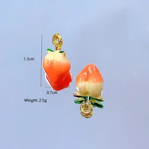 Detailed view of peach-shaped resin pendants with size measurements of 1.3cm by 0.7cm