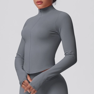 Detail of grey slim fit yoga jacket featuring ribbed texture and athletic thumb holes