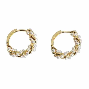 Elegant gold twisted hoop earrings set with small white pearls for a classic jewelry look