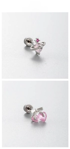 Detail showing pink zircon cherry and planet stud earrings on textured background