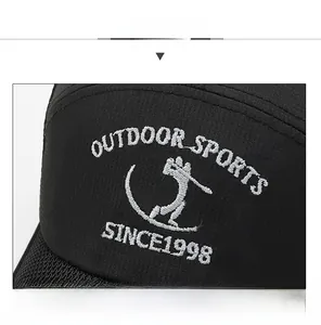 Detailed close-up of white 3D embroidery text on black breathable mesh baseball cap