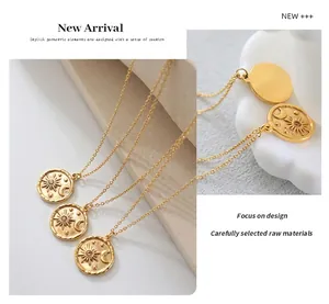 Detailed view of gold star and moon embossed medallion pendant with sparkling zircon accents