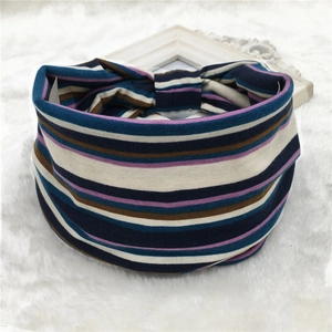 Macro detail of bohemian striped elastic headband fabric with navy and purple patterns