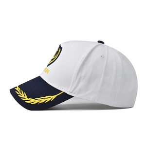 White captain baseball cap with gold anchor embroidery and navy blue brim for maritime style