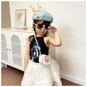 Cute girl model wearing white mini crossbody bag with pink sequin flower decoration