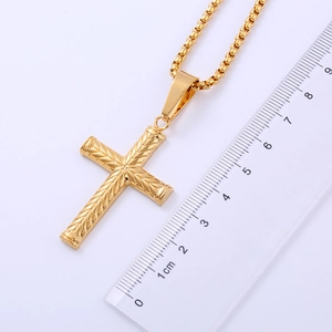 Macro view of 18K gold plated stainless steel cross pendant with size measurement