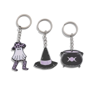 Detail view of 3-piece Halloween keychains with ghost, wizard hat, and black cauldron charms