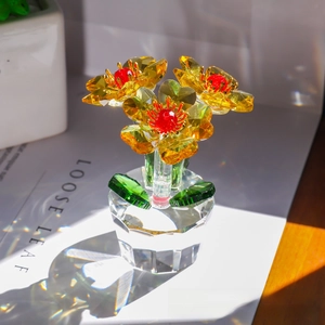 Detailed view of yellow crystal flower ornament with faceted petals and clear base