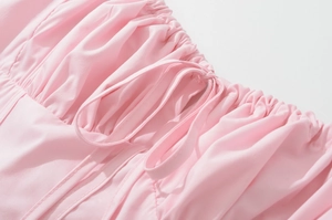 Detail of ruched pink bodice with drawstring ties on French vintage retro summer dress