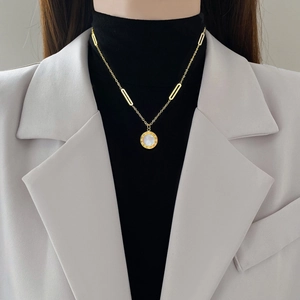 Titanium steel necklace featuring a Roman numeral mother-of-pearl pendant on a gold chain