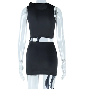 Back view of a black two-piece tight set featuring a crop top and mini skirt on a model