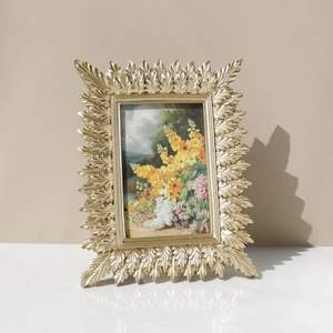 Golden leaf resin photo frame with vintage baroque style and floral painting display