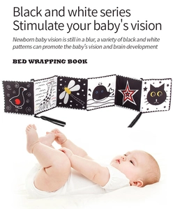 Detail of high-contrast black and white baby cloth book with animal patterns for visual stimulus