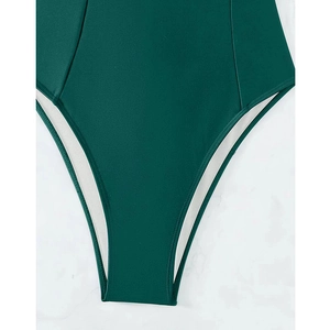 Detail of high-cut leg opening and premium stitching on dark green one-piece swimsuit