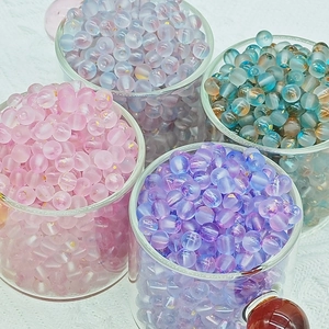 Macro shot of assorted pastel frosted glass beads with gold foil inside for DIY jewelry