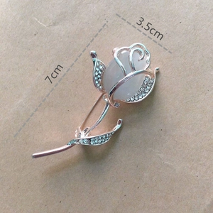 Rose gold flower brooch with opal and cubic zirconia, 7cm by 3.5cm dimensions