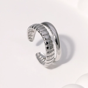Minimalist double-layered silver ring with textured and polished adjustable bands