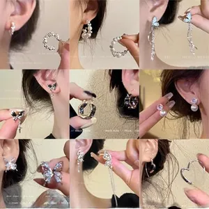 Collage of titanium steel jewelry including pearl earrings and heart studs for women
