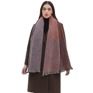 Multicolor woven scarf with fringe tassels worn by a model in a brown winter coat