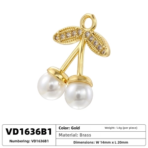 Detailed view of cherry pendant with white pearls and zircon leaves in gold brass finish