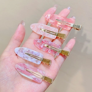 Set of 5 pink marble acetate hair clips with golden metal duckbill grips for women