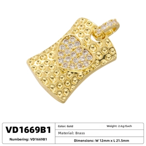 Detail of 12mm x 21.5mm brass heart pendant with gold plating and cubic zirconia inlay