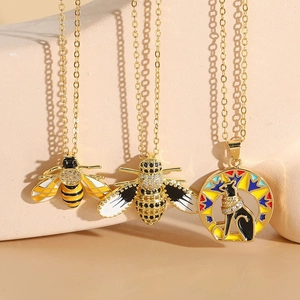 Exquisite 14K gold plated bee pendants with enamel details and bohemian deity charms
