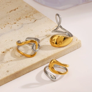 Minimalist two-tone stainless steel ring with elegant organic lines and mixed metal finish