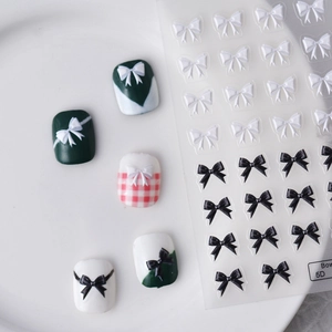 5D embossed bow nail stickers in black and white colors for realistic 3D manicure art