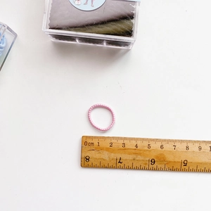 Candy colored elastic hair tie for kids with ruler showing 3cm diameter size
