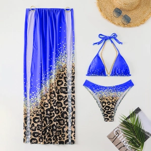 Detail of leopard print three-piece bikini with blue gradient and gold sequins