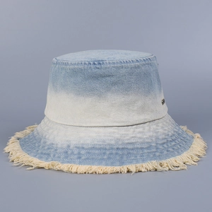Detailed view of ombre denim bucket hat featuring stylish frayed edges and washed finish