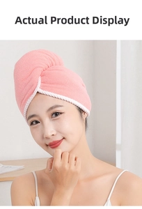 Detail of pink coral fleece hair towel with white piping on an Asian female model