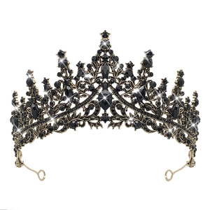 Detailed view of gothic bronze crown with faceted black crystals and vintage alloy base